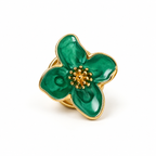 Front view of one emerald green flower button cover with gold-tone trim on a white background