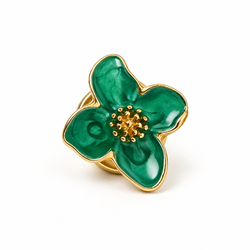 Front view of one emerald green flower button cover with gold-tone trim on a white background